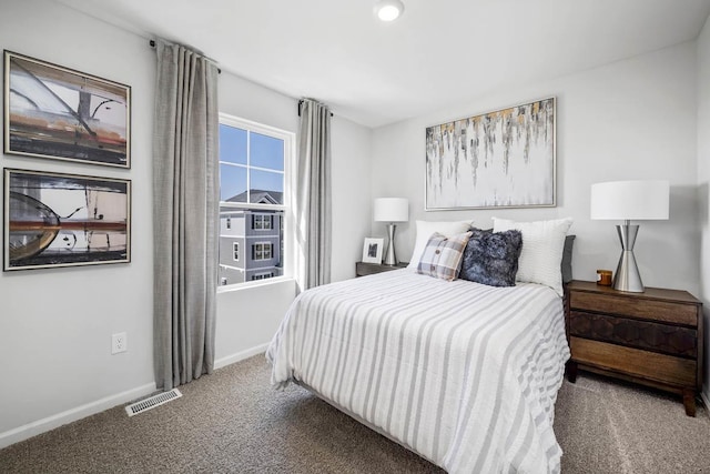 bedroom with baseboards, carpet, and visible vents