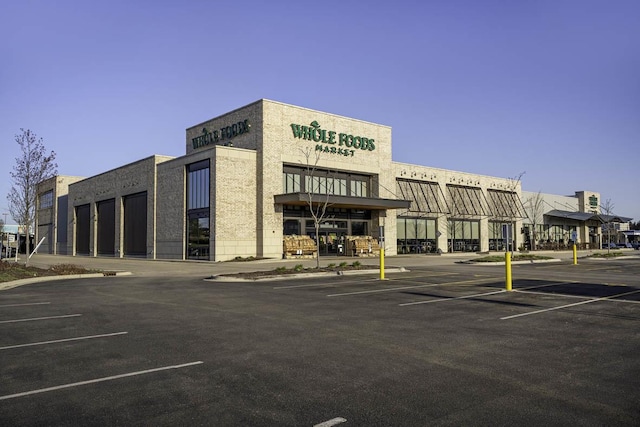 view of property featuring uncovered parking