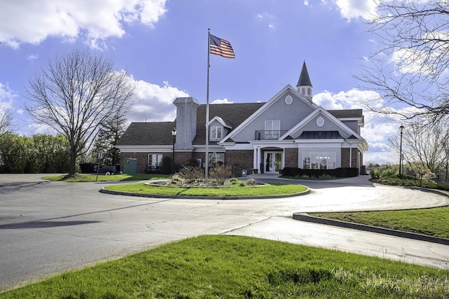 view of property featuring curved driveway