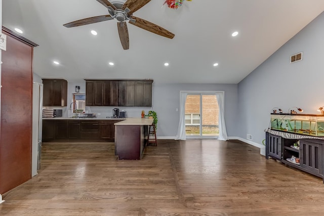 kitchen featuring light countertops, visible vents, wood finished floors, and ceiling fan
