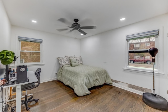 bedroom with a ceiling fan, recessed lighting, baseboards, and wood finished floors