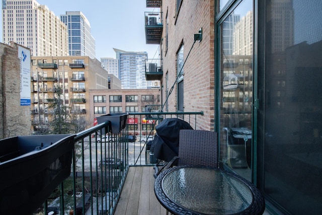 balcony with a city view and a grill