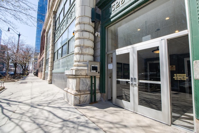 property entrance featuring french doors