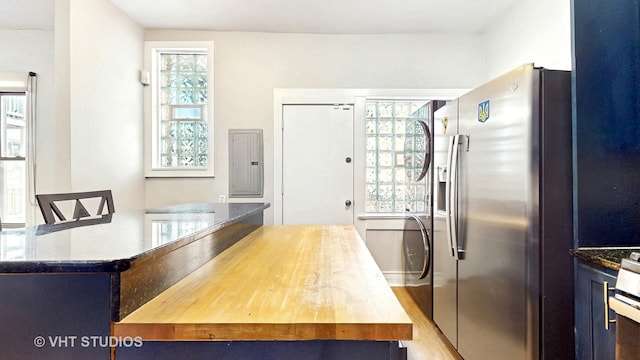 5110 S Woodlawn Ave Unit 2H, Chicago, IL 60615 - kitchen with stainless steel fridge with ice dispenser, stone countertops, and electric panel