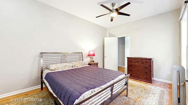 5110 S Woodlawn Ave Unit 2H, Chicago, IL 60615 - bedroom featuring baseboards, a ceiling fan, and wood finished floors