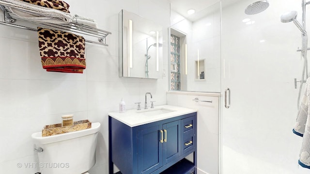 5110 S Woodlawn Ave Unit 2H, Chicago, IL 60615 - bathroom featuring tile walls, toilet, and a stall shower