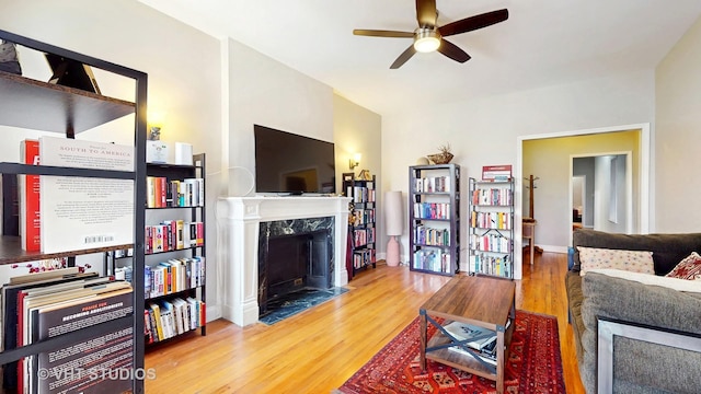 5110 S Woodlawn Ave Unit 2H, Chicago, IL 60615 - living room with baseboards, a ceiling fan, wood finished floors, and a premium fireplace