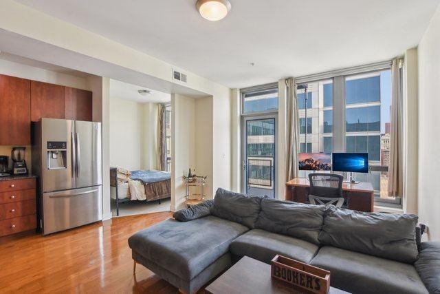 565 W Quincy St Unit 1711, Chicago, IL 60661 - living room with light wood-style flooring and visible vents