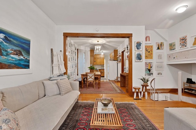 2032 W Iowa St, Chicago, IL 60622 - living area with a chandelier and light wood-style floors