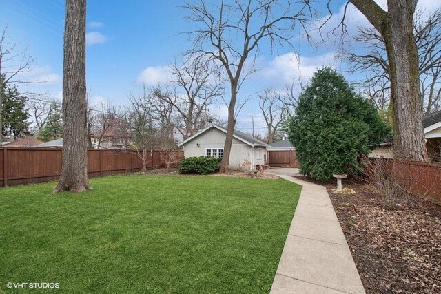 view of yard with a fenced backyard