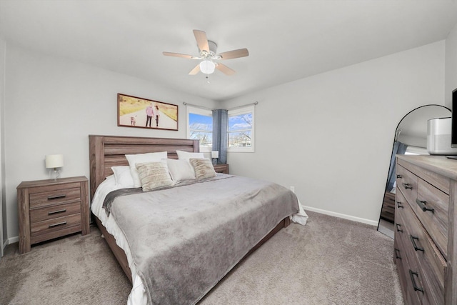 bedroom with light carpet, baseboards, and ceiling fan