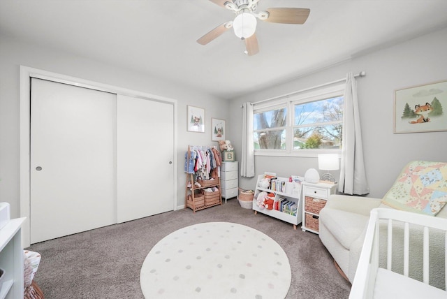 carpeted bedroom featuring a closet and a ceiling fan