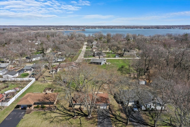 drone / aerial view with a water view and a residential view