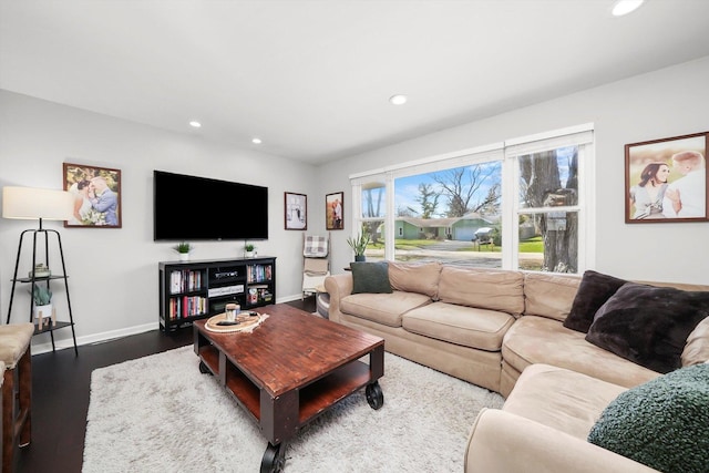living area with baseboards, recessed lighting, and wood finished floors