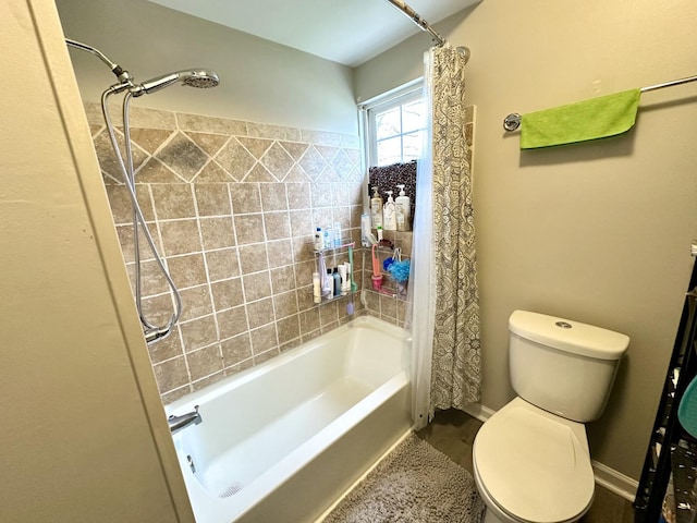 601 S Osborn Ave, Kankakee, IL 60901 - bathroom featuring shower / bath combo with shower curtain and toilet