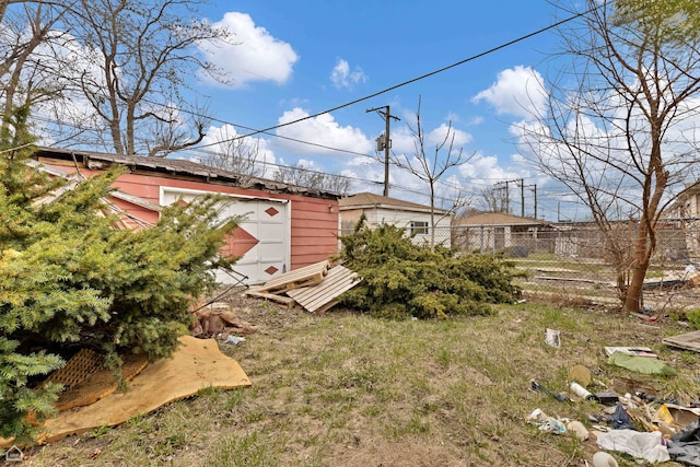 7932 S Kenwood Ave, Chicago, IL 60619 - view of yard with an outdoor structure, a garage, a storage unit, and fence