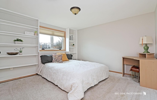 carpeted bedroom with baseboards