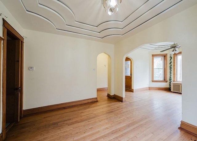 1228 S 59th Ave, Cicero, IL 60804 - unfurnished room featuring arched walkways, light wood-type flooring, baseboards, and ceiling fan