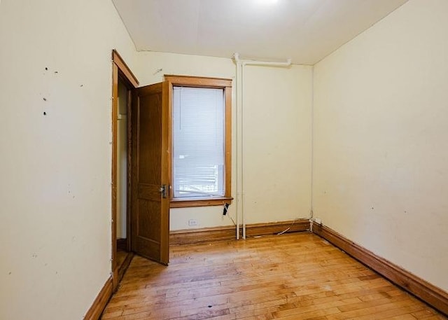 1228 S 59th Ave, Cicero, IL 60804 - empty room featuring baseboards and light wood finished floors