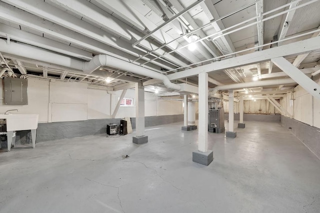 interior space with electric panel and heating unit