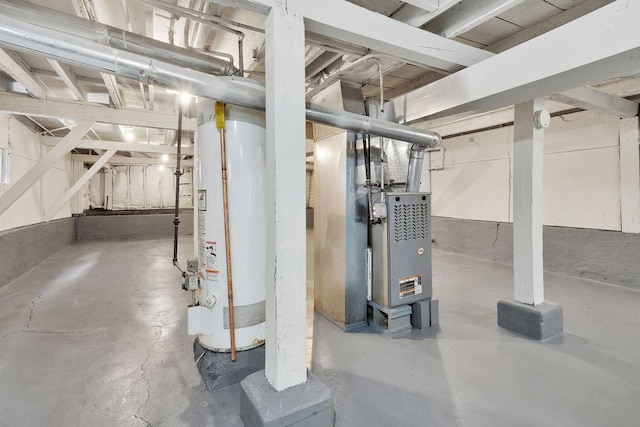 unfinished below grade area with heating unit and gas water heater