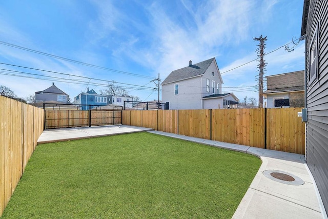 view of yard featuring a fenced backyard and a patio