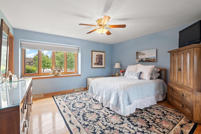 5 Saint Moritz Dr Unit 101, Palos Park, IL 60464 - bedroom with light wood finished floors, baseboards, and ceiling fan