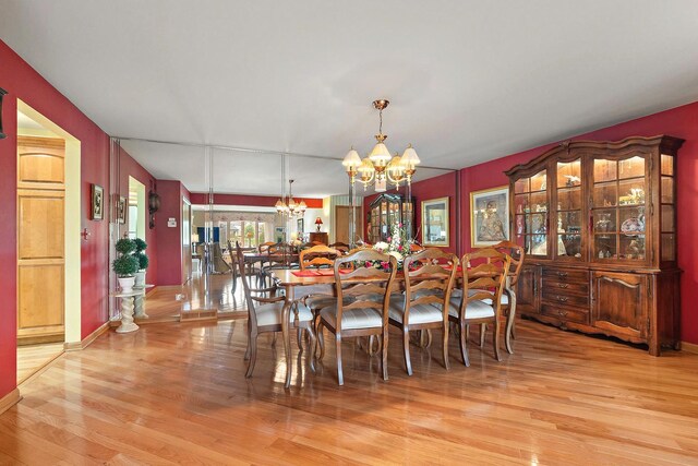 5 Saint Moritz Dr Unit 101, Palos Park, IL 60464 - dining space with a chandelier and wood finished floors
