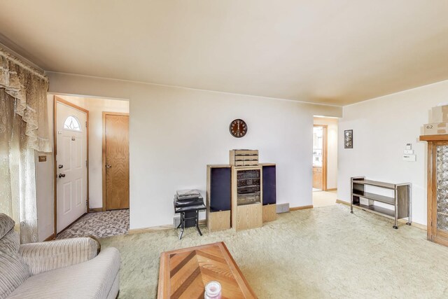 carpeted living room featuring baseboards
