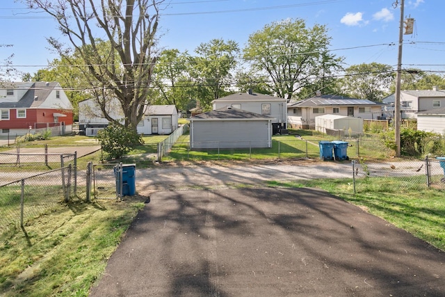 330 Paxton Ave, Calumet City, IL 60409 - view of road featuring a residential view, a gate, and aphalt driveway