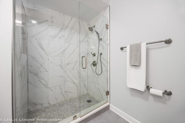 8400 Callie Ave Unit 402, Morton Grove, IL 60053 - bathroom featuring a marble finish shower and baseboards