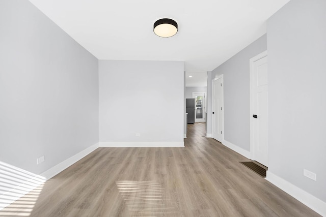 2134 W Shakespeare Ave, Chicago, IL 60647 - empty room with baseboards, light wood finished floors, and visible vents