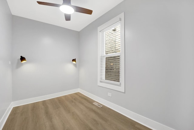 2134 W Shakespeare Ave, Chicago, IL 60647 - unfurnished room featuring baseboards, visible vents, wood finished floors, and a ceiling fan