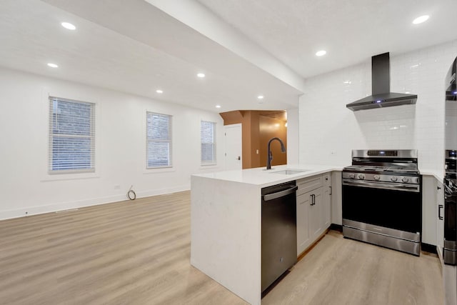 2134 W Shakespeare Ave, Chicago, IL 60647 - kitchen featuring a peninsula, stainless steel gas range, dishwasher, a sink, and wall chimney range hood