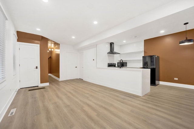 2134 W Shakespeare Ave, Chicago, IL 60647 - unfurnished living room featuring baseboards, recessed lighting, a sink, and light wood-style floors