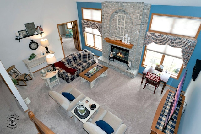 274 N School St, Braidwood, IL 60408 - living room featuring carpet flooring and a fireplace