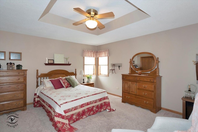 274 N School St, Braidwood, IL 60408 - bedroom featuring a raised ceiling, ceiling fan, light colored carpet, and baseboards