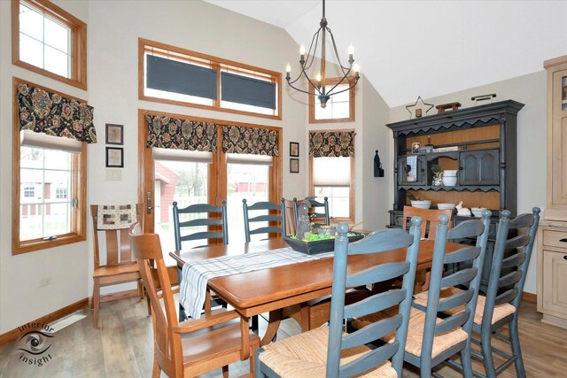 274 N School St, Braidwood, IL 60408 - dining area featuring light wood finished floors, plenty of natural light, and a chandelier