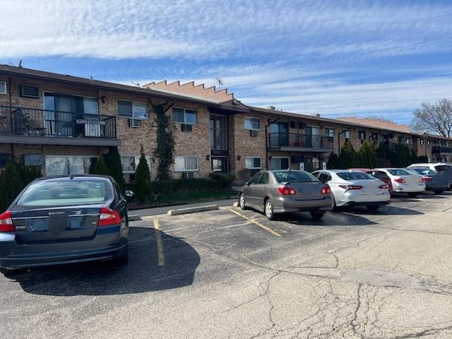 view of property featuring uncovered parking