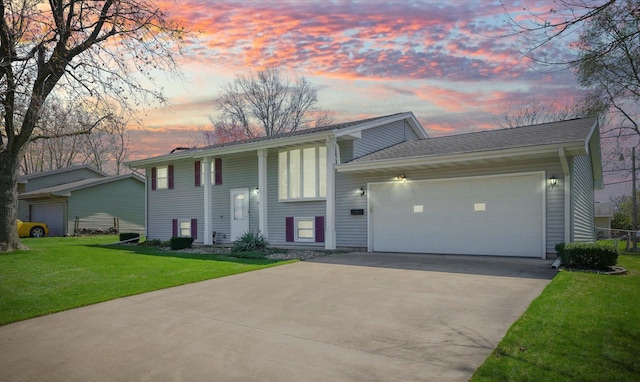 1618 Carolina Dr, Rantoul, IL 61866 - raised ranch with a lawn, a garage, and driveway