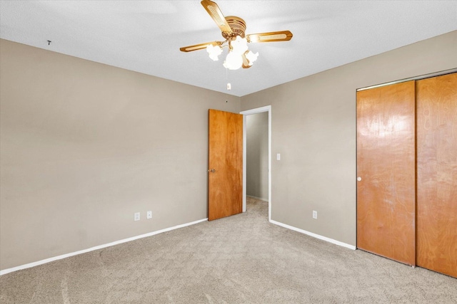 1618 Carolina Dr, Rantoul, IL 61866 - unfurnished bedroom with carpet floors, baseboards, a closet, and ceiling fan