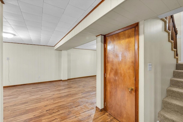 1618 Carolina Dr, Rantoul, IL 61866 - finished below grade area with stairs, baseboards, and wood finished floors