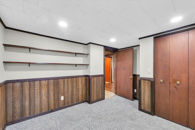 1618 Carolina Dr, Rantoul, IL 61866 - finished basement featuring wooden walls, ornamental molding, a wainscoted wall, and carpet flooring