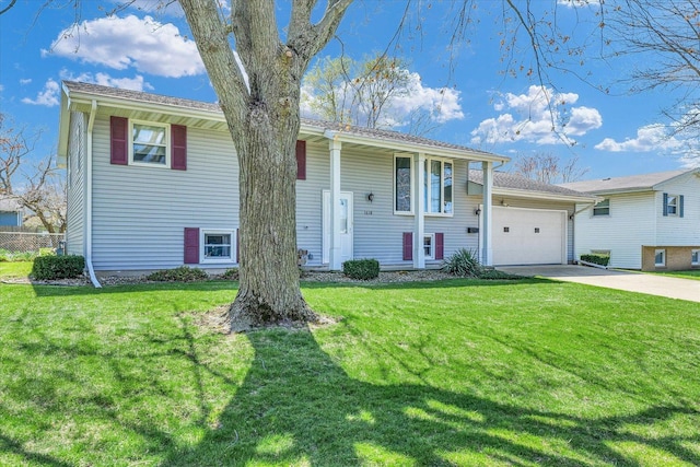 1618 Carolina Dr, Rantoul, IL 61866 - split foyer home with a front yard, driveway, and an attached garage