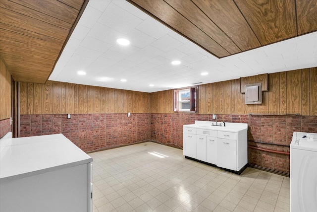 1618 Carolina Dr, Rantoul, IL 61866 - kitchen featuring brick wall, a sink, light countertops, and washer / dryer