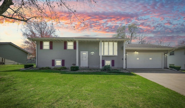 1618 Carolina Dr, Rantoul, IL 61866 - raised ranch with a garage, a front yard, and driveway