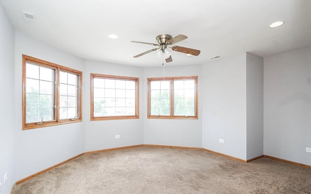 unfurnished room with light carpet, a ceiling fan, baseboards, and recessed lighting