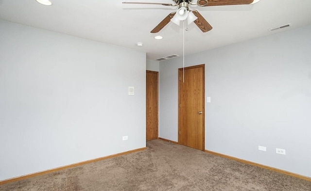 carpeted spare room featuring ceiling fan, recessed lighting, and baseboards