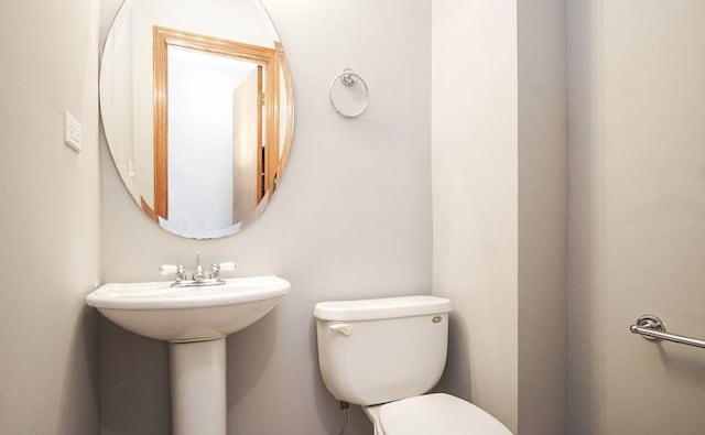 half bath featuring toilet