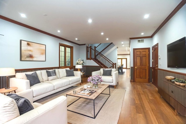 1745 W Cornelia Ave, Chicago, IL 60657 - living room with crown molding, light wood finished floors, stairs, healthy amount of natural light, and wainscoting